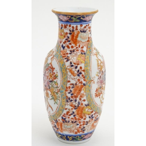 418 - An oriental baluster-shaped vase, enamel-painted with floral bouquets. 8 1/4'' high