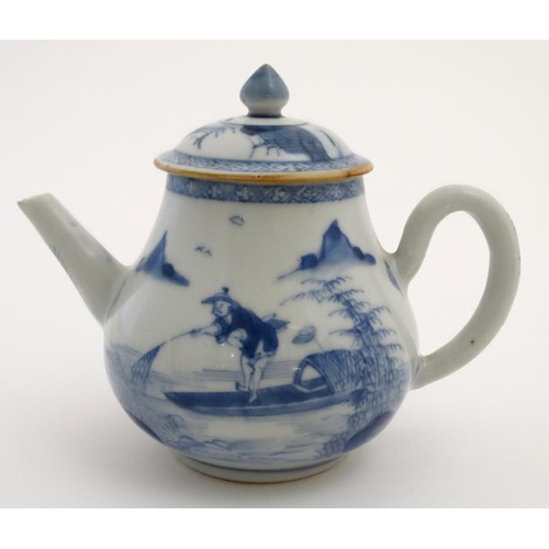 419 - A Chinese blue and white teapot  decorated to sides with figure in a boat fishing on a lake in a mou... 