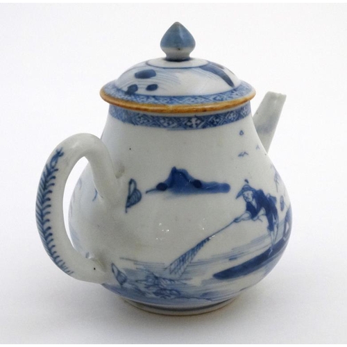 419 - A Chinese blue and white teapot  decorated to sides with figure in a boat fishing on a lake in a mou... 