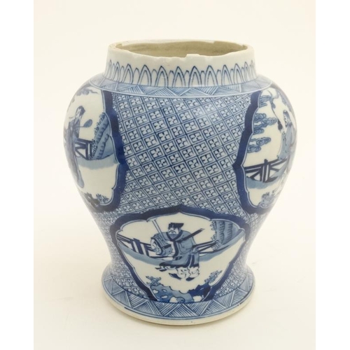 424 - A Chinese blue and white baluster vase , having decorative cartouches depicting figures in a range o... 