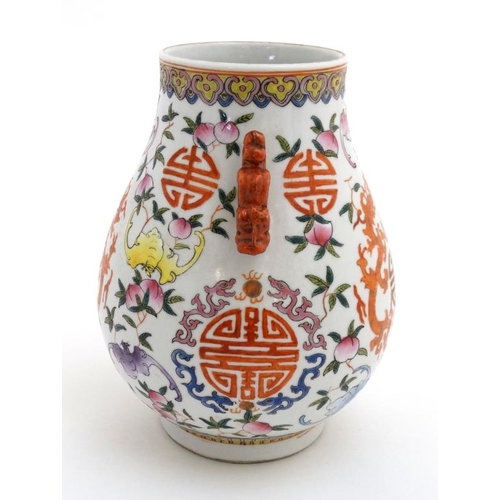 432 - A Chinese famille rose two handled bailuzun vase decorated in polychrome enamels with Chinese luck s... 