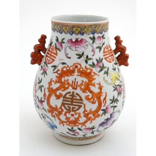 432 - A Chinese famille rose two handled bailuzun vase decorated in polychrome enamels with Chinese luck s... 