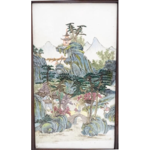 436 - A Chinese famille rose ceramic panel , in wooden frame on wooden stand, the panel decorated in polyc... 