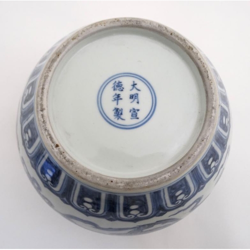 440 - A Chinese Blue and white pomegranate jar  decorated with Dogs of Fo and pearls of wisdom amongst ten... 