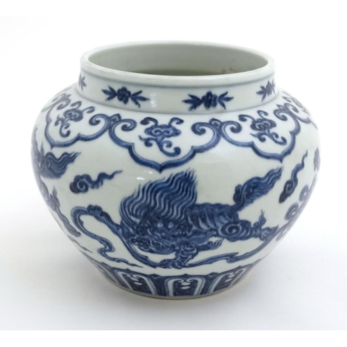 440 - A Chinese Blue and white pomegranate jar  decorated with Dogs of Fo and pearls of wisdom amongst ten... 