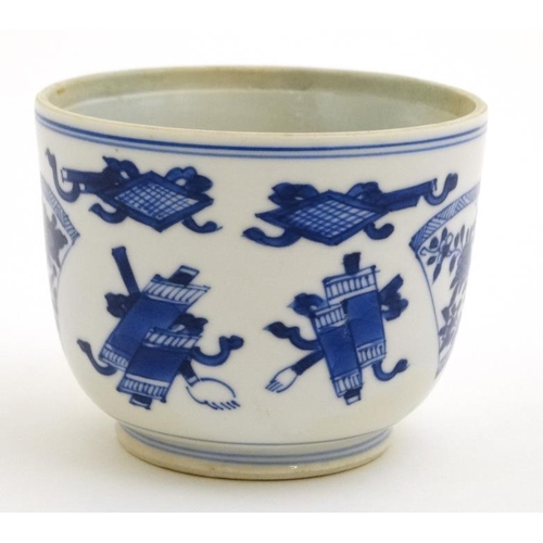 441 - A Chinese blue and white tea bowl decorated with scrolls and fan shaped floral cartouches. 2 3/4'' h... 