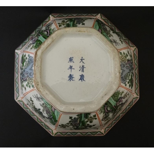 442 - A large Chinese bowl of tapering octagonal form , the 8 panels decorated in shades of green, purple ... 