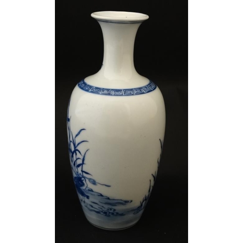 445 - A Chinese blue and white vase with flared rim decorated with ducks amongst reeds, bears blue Chinese... 