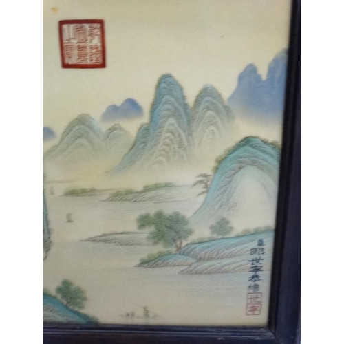 454 - A large pair of Chinese ceramic panels in wooden frames, each having two panels decorated with river... 