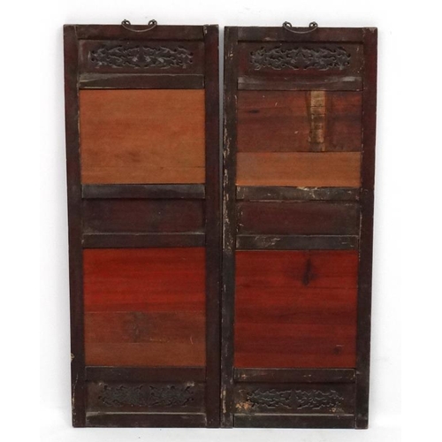 454 - A large pair of Chinese ceramic panels in wooden frames, each having two panels decorated with river... 