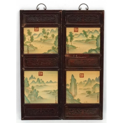 454 - A large pair of Chinese ceramic panels in wooden frames, each having two panels decorated with river... 