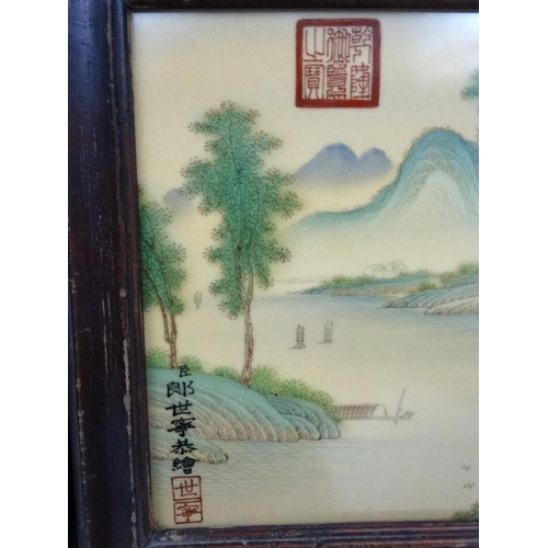 454 - A large pair of Chinese ceramic panels in wooden frames, each having two panels decorated with river... 