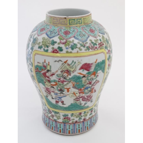 456 - A Chinese famille rose vase , the panels decorated with figures in a pagoda scene and warring figure... 