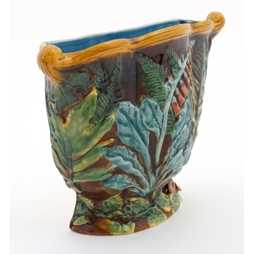 475 - A large Minton Majolica wall planter / jardineire , decorated with fox gloves, decorated in shades o... 