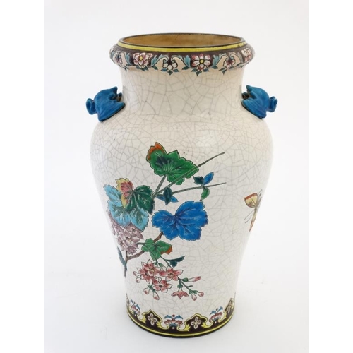 477 - A Longwy two handled crackle glaze vase, decorated in polychrome enamels with birds and flowering bo... 