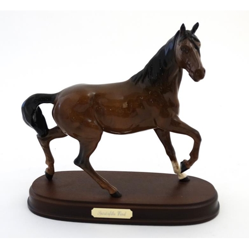 486 - A boxed Royal Doulton 'Spirit of the Wind' bay horse figurine  in gloss finish , on wooden base havi... 