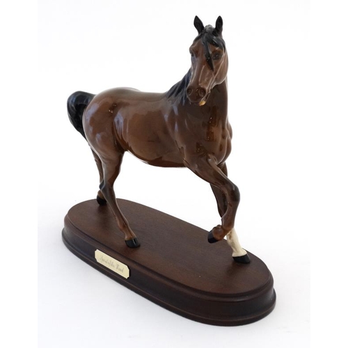 486 - A boxed Royal Doulton 'Spirit of the Wind' bay horse figurine  in gloss finish , on wooden base havi... 