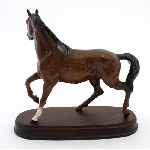 486 - A boxed Royal Doulton 'Spirit of the Wind' bay horse figurine  in gloss finish , on wooden base havi... 