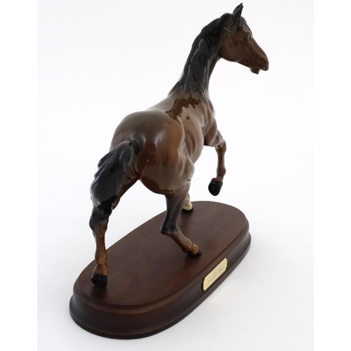 486 - A boxed Royal Doulton 'Spirit of the Wind' bay horse figurine  in gloss finish , on wooden base havi... 