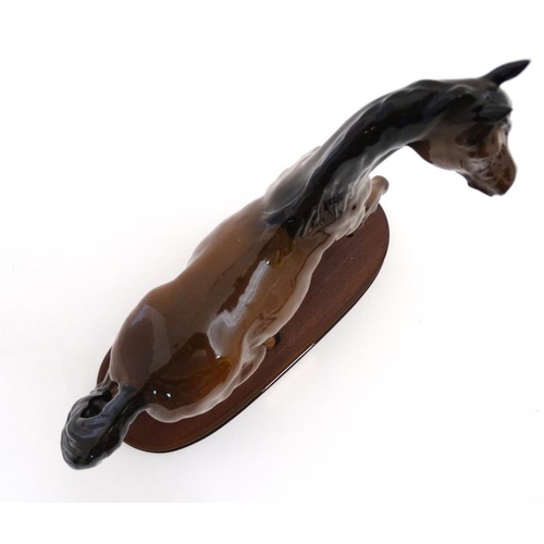 486 - A boxed Royal Doulton 'Spirit of the Wind' bay horse figurine  in gloss finish , on wooden base havi... 