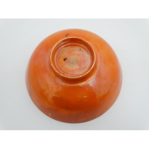 487 - A small Royal Doulton lustre glazed orange bowl, bears factory stamp to base. 5 1/4'' diameter.