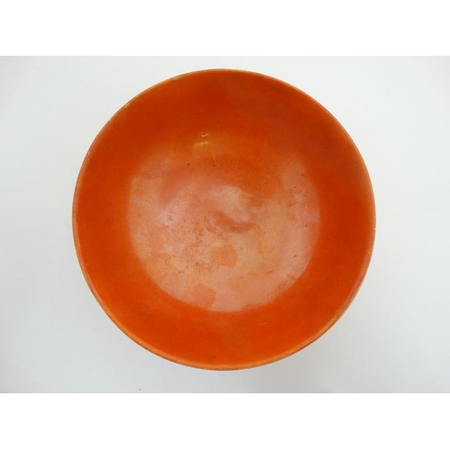 487 - A small Royal Doulton lustre glazed orange bowl, bears factory stamp to base. 5 1/4'' diameter.