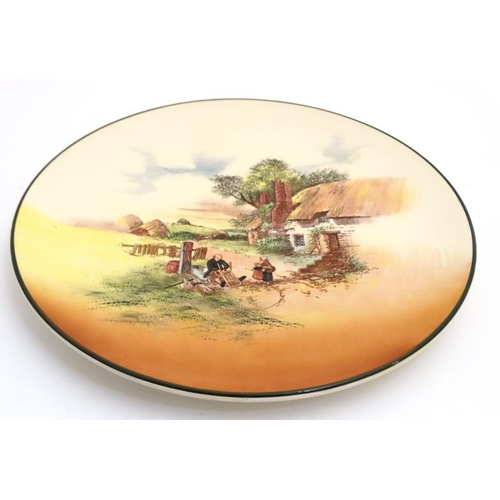 492 - A Royal Doulton  '' Rustic England '' wall charger D5694 with green border. Showing scene number 8 '... 