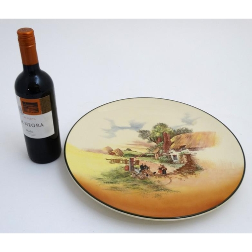 492 - A Royal Doulton  '' Rustic England '' wall charger D5694 with green border. Showing scene number 8 '... 