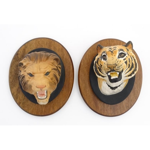 497 - A Beswick lion's head wall plaque , number 2933 and a Beswick Tiger's head wall plaque , from the 'W... 