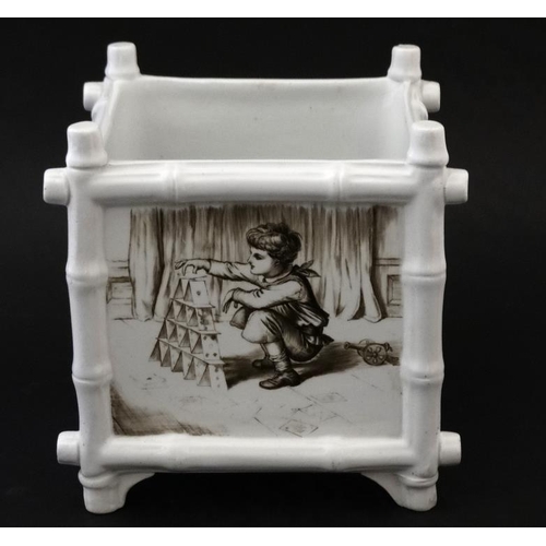 501 - A black and white transfer printed  jardiniere of square form , the panels decorated with scenes of ... 