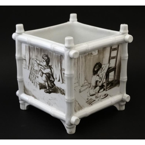 501 - A black and white transfer printed  jardiniere of square form , the panels decorated with scenes of ... 