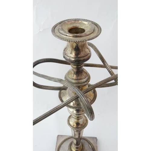 45 - A silver plate 5 branch candelabra on a squared base with 4 ball feet Approx 19'' high  Please Note ... 