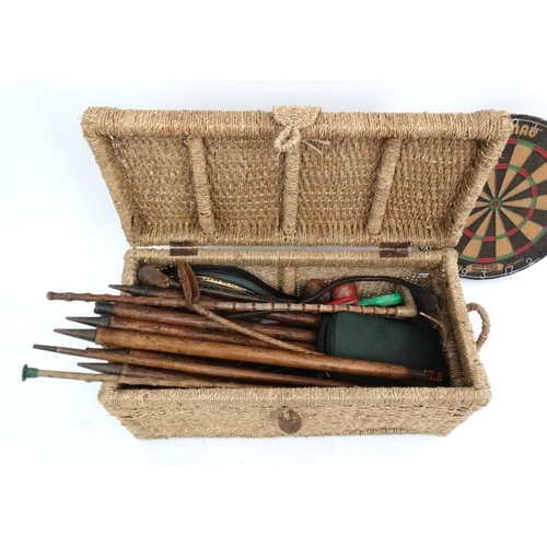 109 - A collection of sporting equipment, to include 2 antler handled riding sticks, a cased set of 8 boul... 