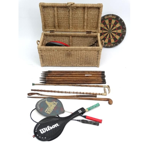 109 - A collection of sporting equipment, to include 2 antler handled riding sticks, a cased set of 8 boul... 