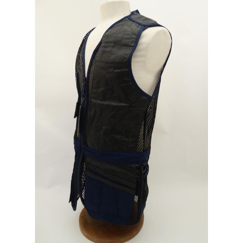 194 - A Deerhunter Champ Deluxe Mesh back , left handed skeet vest in Navy, size M.