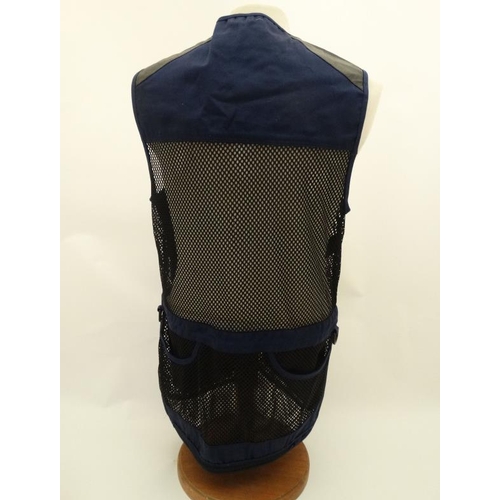 194 - A Deerhunter Champ Deluxe Mesh back , left handed skeet vest in Navy, size M.