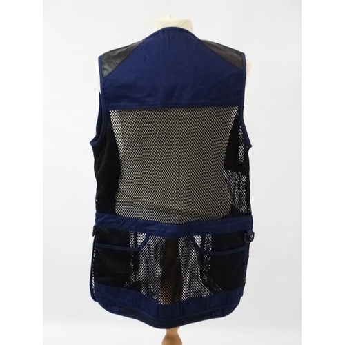 194 - A Deerhunter Champ Deluxe Mesh back , left handed skeet vest in Navy, size M.