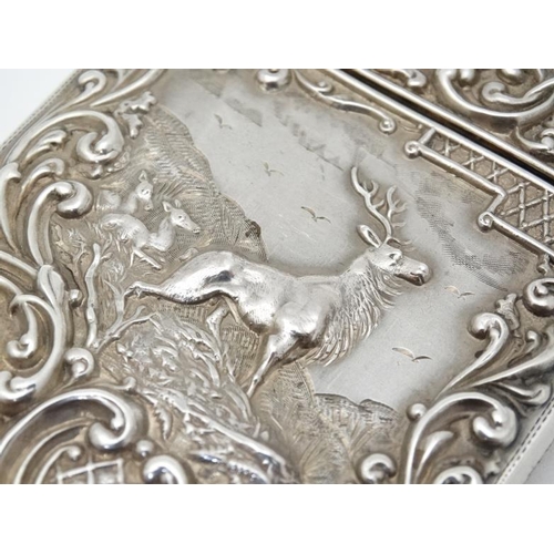 203 - Stag : A Silver card case with embossed acanthus and C-scroll decoration and image to front depictin... 