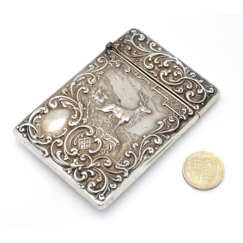 203 - Stag : A Silver card case with embossed acanthus and C-scroll decoration and image to front depictin... 