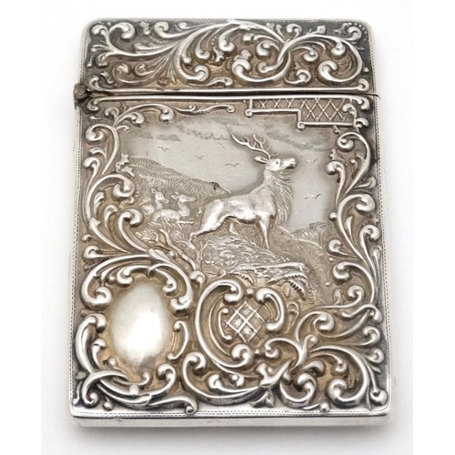 203 - Stag : A Silver card case with embossed acanthus and C-scroll decoration and image to front depictin... 