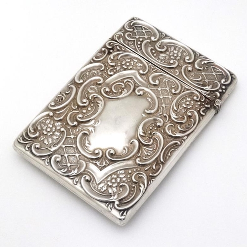 203 - Stag : A Silver card case with embossed acanthus and C-scroll decoration and image to front depictin... 