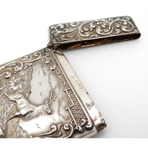 203 - Stag : A Silver card case with embossed acanthus and C-scroll decoration and image to front depictin... 