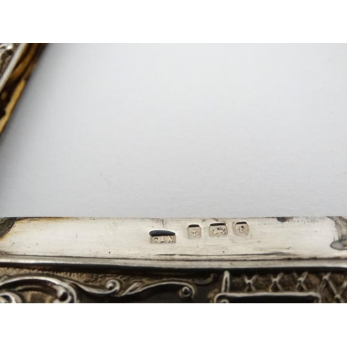 203 - Stag : A Silver card case with embossed acanthus and C-scroll decoration and image to front depictin... 