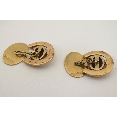 205 - Hunting Interest : 9ct gold cufflinks with horse shoe and fox mask decoration, the fox heads set wit... 