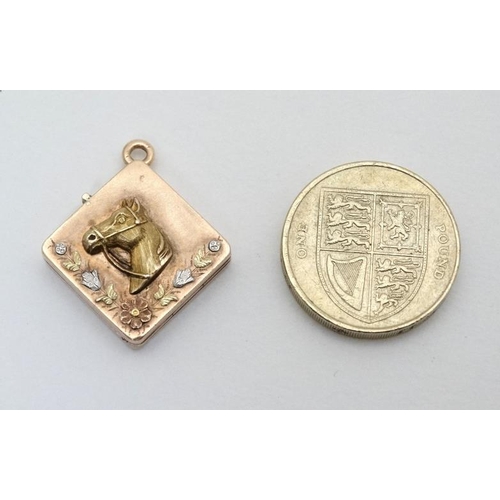 211 - Equine Interest : A yellow metal locket of squared form with horse head floral and foliate decoratio... 