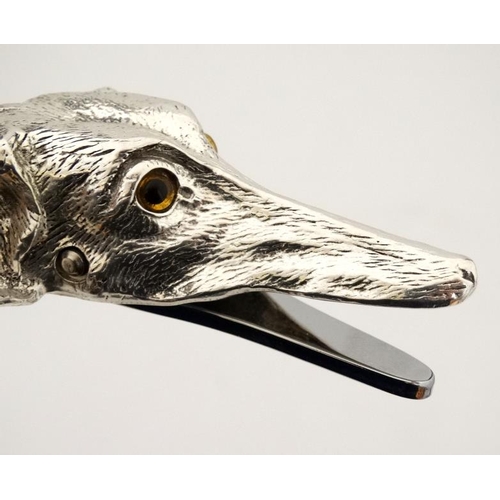 213 - A silver plate desk top letter clip in the form of a dogs head. 21stC.  5'' long