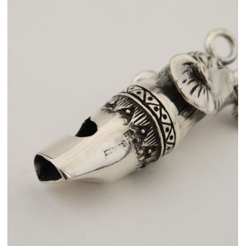 215 - A novelty silver whistle with elephant head decoration. 21stC  1 1/2'' long