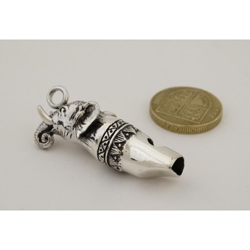 215 - A novelty silver whistle with elephant head decoration. 21stC  1 1/2'' long