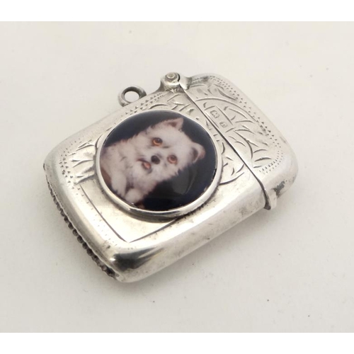 216 - A silver vesta case with hinged lid and striker under. Hallmarked Birmingham 1916  with later applie... 