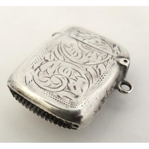 216 - A silver vesta case with hinged lid and striker under. Hallmarked Birmingham 1916  with later applie... 